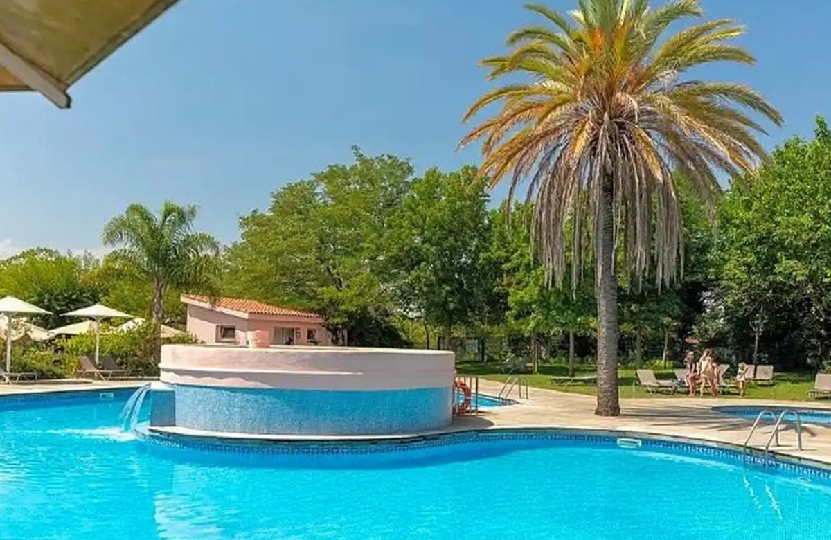 Pool and palms at Alannia El Pinar, Blanes, Costa Brava